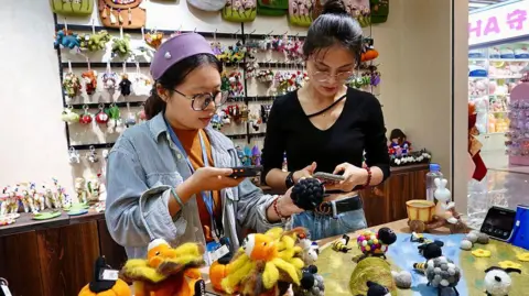 China’s biggest shopping event starts five weeks early to revive spending